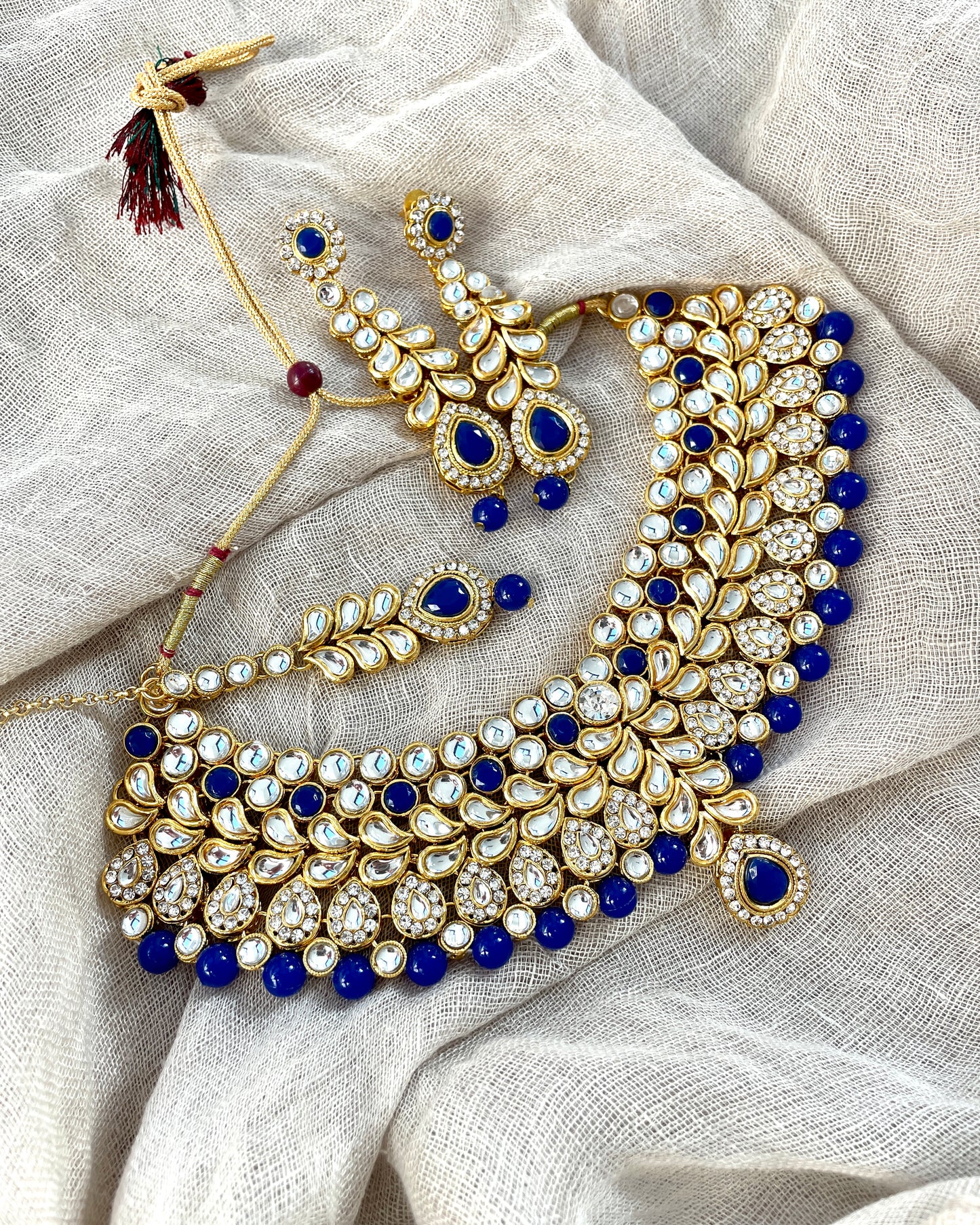 Goudkleurige sieradenset - donkerblauw