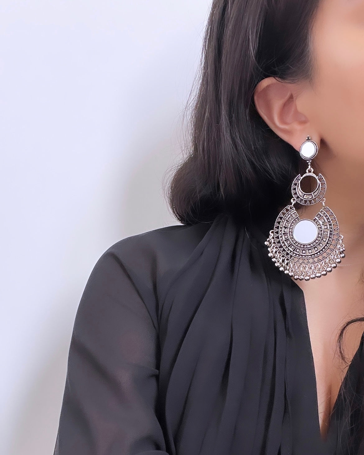 Silver-colored statement earrings