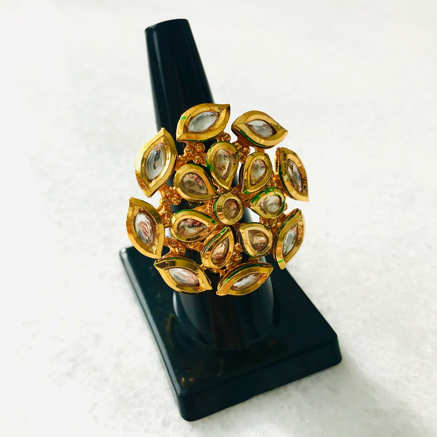 Gold colored round statement ring