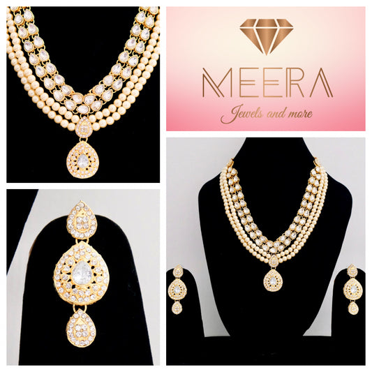 Gold-colored jewelry set with pearls