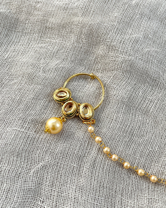 Gold colored nose ring