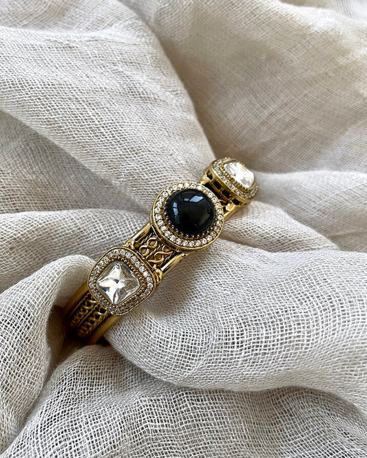 Gold colored bracelet - black