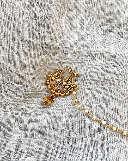 Gold colored nose ring