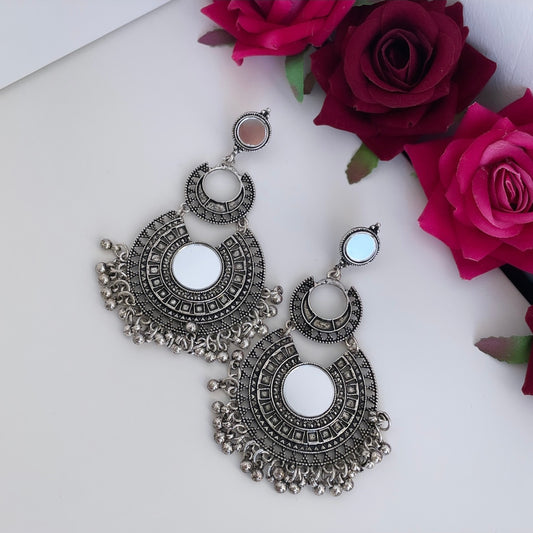 Silver-colored statement earrings