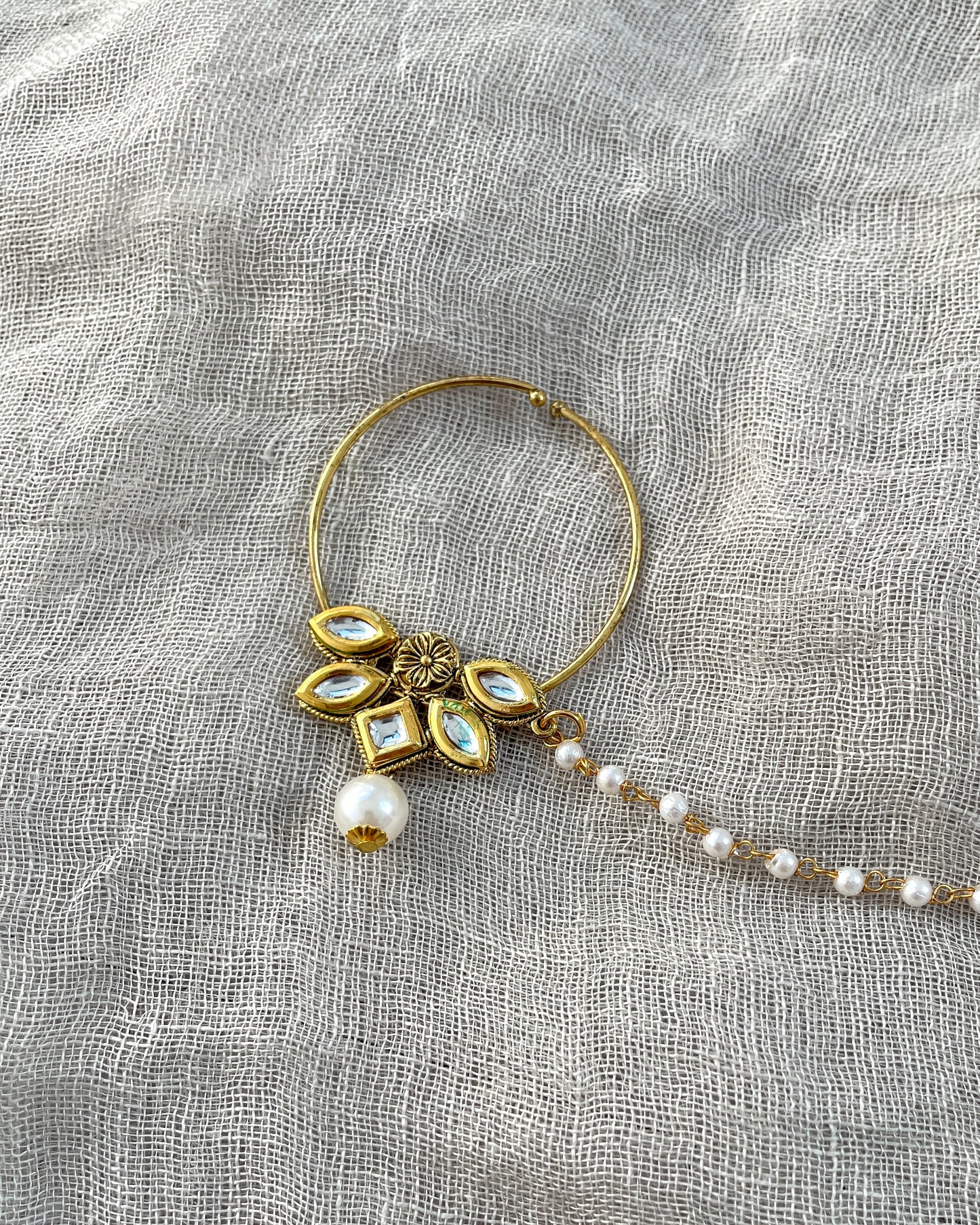 Gold-colored statement nose ring