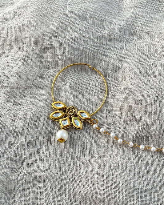 Gold-colored statement nose ring