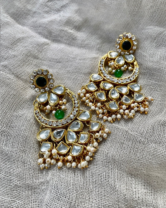 Gold colored chandbali with green details