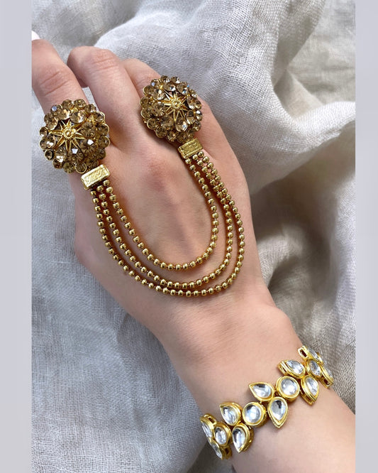 Gold colored double ring - star