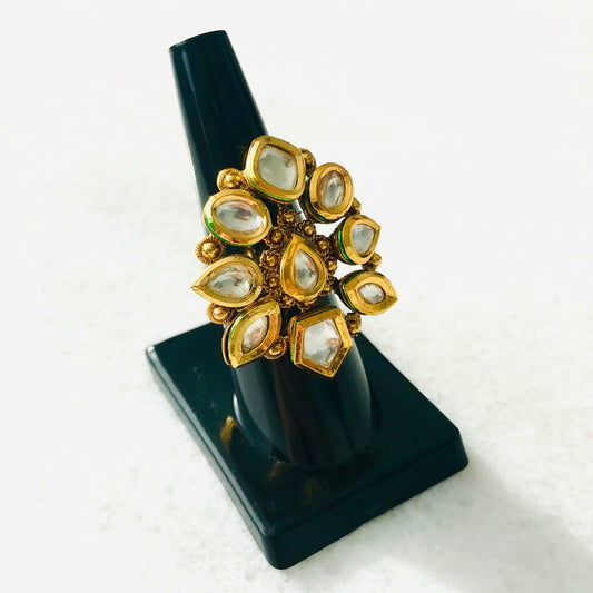 Gold colored faux kundan ring white